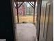 View from doorway onto backyard with a red barn in the distance, offering a serene, private setting at 5700 Miles Rd, South Fulton, GA 30349