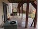 Backyard area featuring a deck with grilling equipment, concrete surface, and partial fence boundary at 5700 Miles Rd, South Fulton, GA 30349
