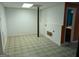 Spacious unfinished basement area with concrete flooring, awaiting customization and ample storage at 5700 Miles Rd, South Fulton, GA 30349