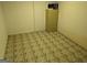 Unfinished basement space with patterned tile flooring, ready for customization, and additional storage space at 5700 Miles Rd, South Fulton, GA 30349