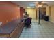 Large basement with extensive counter space, a partial kitchen, and two ceiling fans at 5700 Miles Rd, South Fulton, GA 30349