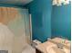 Bathroom featuring blue walls, a vanity with a sink, and a toilet with a shower and curtain at 5700 Miles Rd, South Fulton, GA 30349