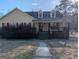 Charming single-story home featuring a welcoming front porch and well-maintained landscaping at 5700 Miles Rd, South Fulton, GA 30349