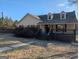 Charming single-story home featuring a welcoming front porch and well-maintained landscaping at 5700 Miles Rd, South Fulton, GA 30349