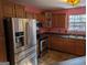 Well-equipped kitchen with stainless steel appliances and wood cabinets at 5700 Miles Rd, South Fulton, GA 30349