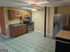 Basement kitchen has stainless steel appliances and a tile floor at 5700 Miles Rd, South Fulton, GA 30349