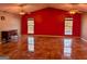 Spacious living room featuring glossy tile flooring and large windows for natural light at 5700 Miles Rd, South Fulton, GA 30349