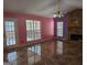 Cozy living space with tile floors, and a floor to ceiling stone fireplace at 5700 Miles Rd, South Fulton, GA 30349