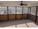 Relaxing screened porch offers outdoor living space and views of the backyard at 5700 Miles Rd, South Fulton, GA 30349