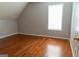 Cozy bedroom with hardwood floors and a window that invites natural light, creating a comfortable space at 5113 Heritage Oaks Sw Ln, Powder Springs, GA 30127
