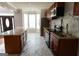 Spacious kitchen with marble countertops and backsplash, stainless steel appliances, and tile flooring at 5113 Heritage Oaks Sw Ln, Powder Springs, GA 30127