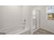Bright bathroom features tub, separate shower with glass doors, tile flooring and window at 624 Whitman Lane # 2032, Stockbridge, GA 30281