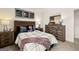 Cozy bedroom featuring rustic wood furniture, sports themed decor, offering a warm and inviting personal space at 624 Whitman Lane # 2032, Stockbridge, GA 30281
