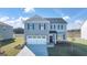 Charming two-story home with a manicured lawn and a two-car garage, perfect for a growing Gathering at 624 Whitman Lane # 2032, Stockbridge, GA 30281