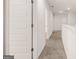 Bright hallway featuring neutral carpet and white trim throughout the upstairs of this lovely home at 624 Whitman Lane # 2032, Stockbridge, GA 30281