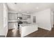 Kitchen featuring hard surface floors, gray cabinets, stainless appliances, and kitchen island at 624 Whitman Lane # 2032, Stockbridge, GA 30281