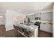 Open-concept kitchen with stainless steel appliances, granite countertops, and island seating at 624 Whitman Lane # 2032, Stockbridge, GA 30281