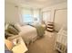 Bright bedroom featuring a comfortable bed and neutral decor with two closets and ample natural light at 3095 Holbrook Sw Dr, Marietta, GA 30060