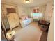Comfortable bedroom featuring a daybed, an antique closet, and hardwood floors at 3095 Holbrook Sw Dr, Marietta, GA 30060