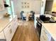 Bright eat-in kitchen with stainless steel appliances, white cabinetry, and a breakfast nook at 3095 Holbrook Sw Dr, Marietta, GA 30060