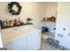 Functional laundry room with modern washer and dryer and stylish tiled floor at 3095 Holbrook Sw Dr, Marietta, GA 30060