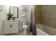 Neat bathroom with floating shelves, a large mirror, and tiled walls, providing a serene atmosphere at 1818 Butterfly Way, Marietta, GA 30066