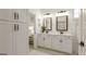 Bright bathroom with double sink vanity, black hardware, and walk-in shower with glass door at 1818 Butterfly Way, Marietta, GA 30066