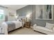 This bedroom features an accent wall, a large window, and a bed with plenty of natural light at 1818 Butterfly Way, Marietta, GA 30066