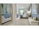 Spacious primary suite with serene blue accents, a comfortable bed, and stylish furnishings at 1818 Butterfly Way, Marietta, GA 30066