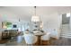Open-concept dining area featuring modern decor, stylish lighting, and an adjacent staircase at 1818 Butterfly Way, Marietta, GA 30066