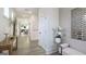 Inviting hallway featuring light wood floors, white trim, and a view into the open living spaces at 1818 Butterfly Way, Marietta, GA 30066