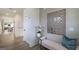 Bright, modern hallway with wood floors, white doors, and a stylish accent wall with decorative mirror and bench at 1818 Butterfly Way, Marietta, GA 30066