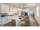 Modern kitchen featuring an island with seating, stainless steel appliances, and sleek white cabinetry at 1818 Butterfly Way, Marietta, GA 30066