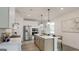 Bright kitchen featuring an island, stainless steel appliances, and modern pendant lighting at 1818 Butterfly Way, Marietta, GA 30066