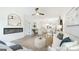 Open living space with a fireplace, view to kitchen and an open floor plan at 1818 Butterfly Way, Marietta, GA 30066