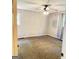 Neutral bedroom featuring a ceiling fan, carpeted floors, and bright natural light from two windows at 401 Mt. Tabor Church Rd., Dallas, GA 30157