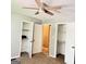 Bedroom with ceiling fan, carpeted floors, and closet storage at 401 Mt. Tabor Church Rd., Dallas, GA 30157