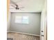 Bedroom with window, ceiling fan, carpeted floors, and light gray walls at 401 Mt. Tabor Church Rd., Dallas, GA 30157