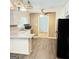 Kitchen featuring white cabinets, laminate countertops, a refrigerator, and wood-look flooring at 401 Mt. Tabor Church Rd., Dallas, GA 30157
