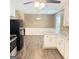Kitchen featuring white cabinets, laminate countertops, a refrigerator, and wood-look flooring at 401 Mt. Tabor Church Rd., Dallas, GA 30157
