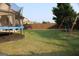 The backyard features a trampoline and swing set for added outdoor recreation and Gathering fun at 878 W Union Grove Cir, Auburn, GA 30011