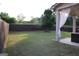 Landscaped backyard featuring a well-maintained lawn and an outdoor patio area at 878 W Union Grove Cir, Auburn, GA 30011