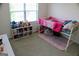 Bright bedroom with a bunk bed, stuffed animals, and a view of the outside through the window at 878 W Union Grove Cir, Auburn, GA 30011
