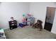 Play room with window, neutral colored walls and carpet, and toys at 878 W Union Grove Cir, Auburn, GA 30011