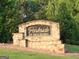 Parkside at Mulberry neighborhood stone sign surrounded by lush greenery and manicured landscaping at 878 W Union Grove Cir, Auburn, GA 30011