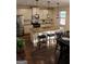 Bright kitchen featuring granite countertops, stainless steel appliances, island, and pendant lighting at 878 W Union Grove Cir, Auburn, GA 30011
