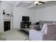 Spacious living room featuring a fireplace, ceiling fan, and comfortable seating at 878 W Union Grove Cir, Auburn, GA 30011