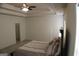 Relaxing bedroom with stylish tray ceiling, comfortable bed, and access to the Primary bath at 878 W Union Grove Cir, Auburn, GA 30011