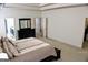 This spacious main bedroom features a comfortable bed and multiple doorways to other rooms at 878 W Union Grove Cir, Auburn, GA 30011