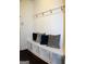 Mud room with built-in bench, storage cubbies, and decorative pillows for comfortable seating at 878 W Union Grove Cir, Auburn, GA 30011